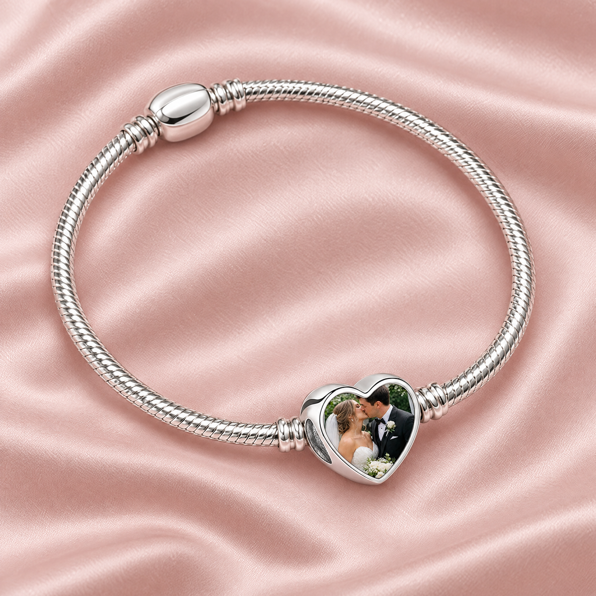 Personalized Custom Photo Charm, on a charm bracelet laid on blush silk