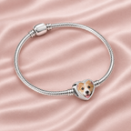 Personalized Custom Photo Dog Bone Charm, on a charm bracelet laid on blush silk