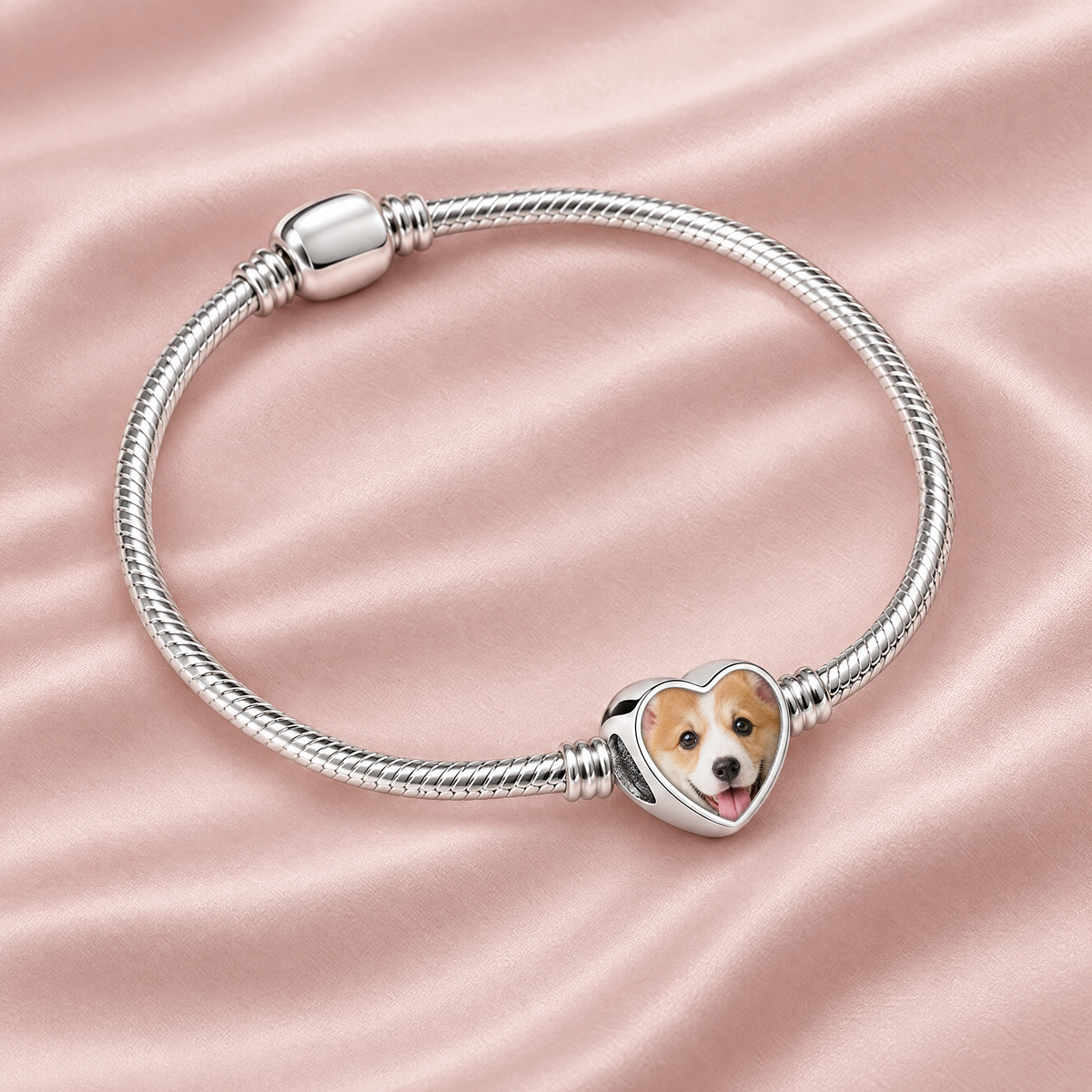 Personalized Custom Photo Dog Bone Charm, on a charm bracelet laid on blush silk