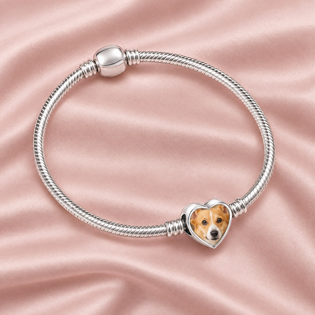Personalized Custom Photo Dog Paw Charm, on a charm bracelet laid on blush silk