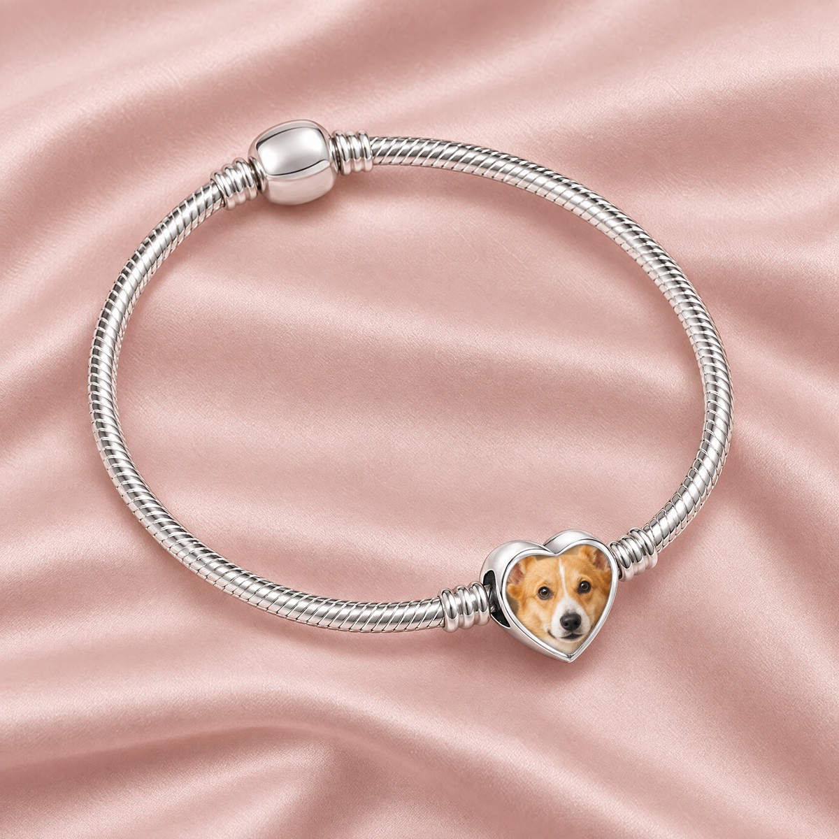 Personalized Custom Photo Dog Paw Charm, on a charm bracelet laid on blush silk