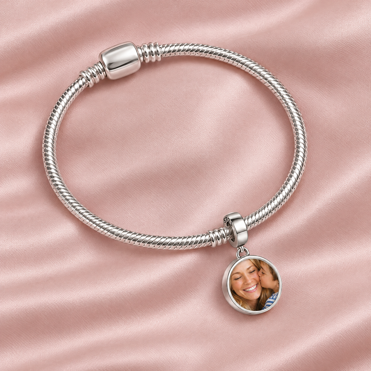 Personalized Custom Photo Forever Love Charm, on a charm bracelet laid on blush silk
